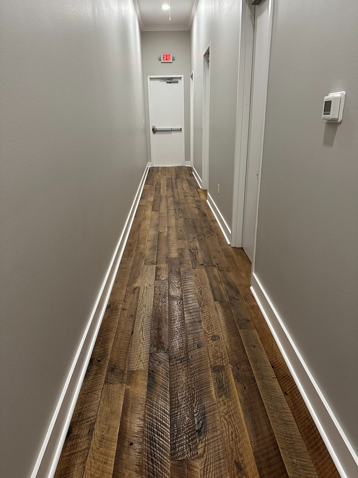 Finished corridor with wood-plank flooring