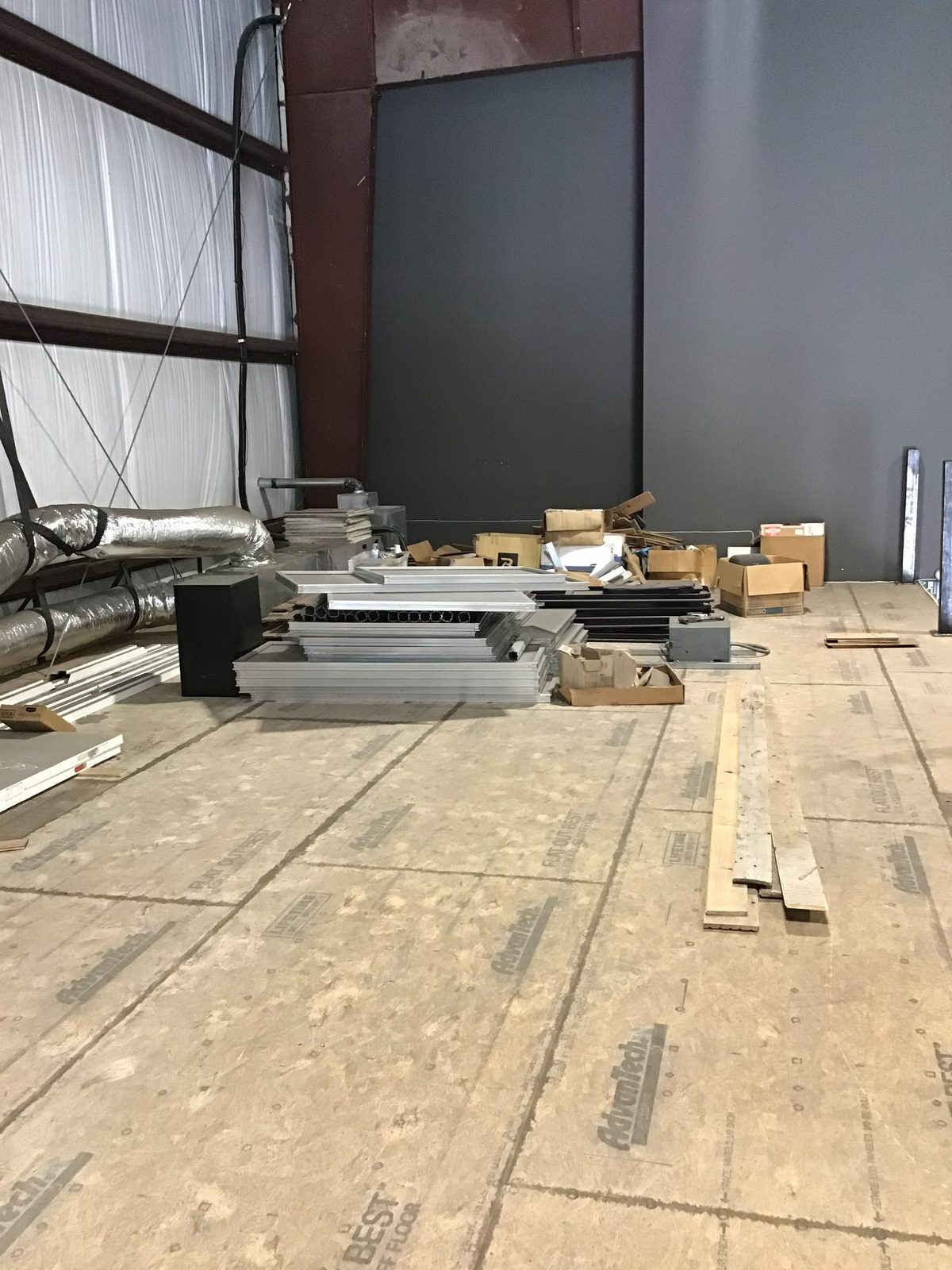 Interior buildout in progress with materials staged