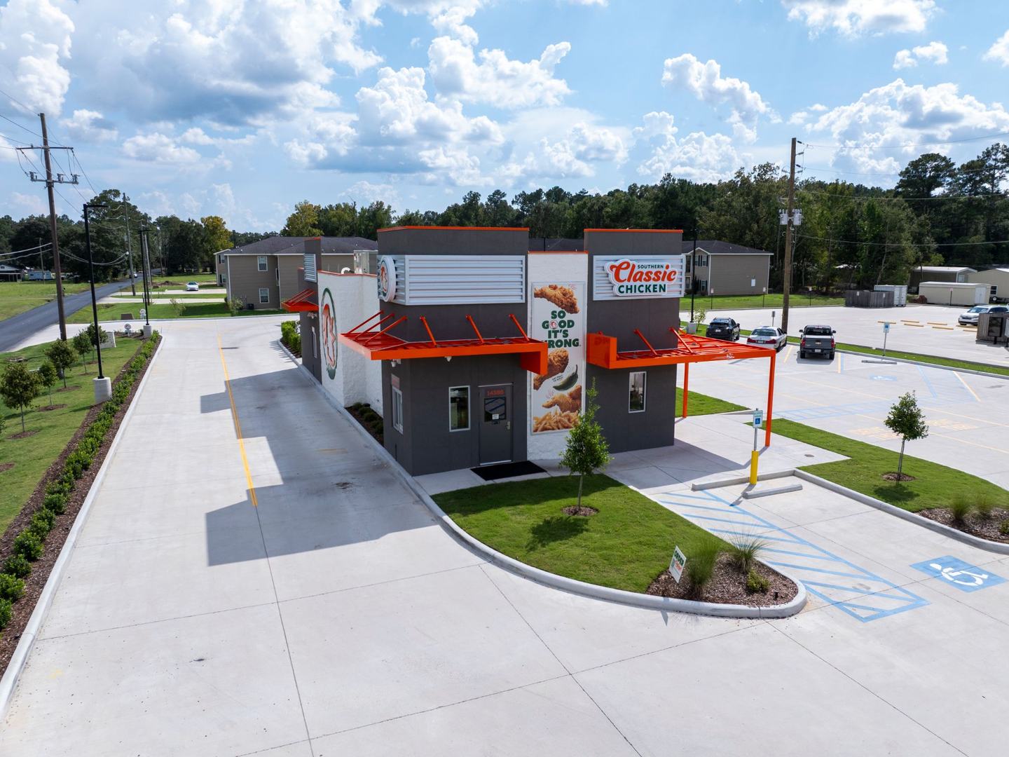Finished Southern Classic Chicken restaurant: aerial view of the building, drive-thru lane and parking